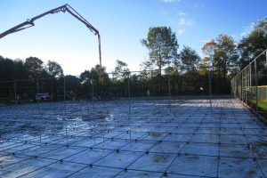 Bunnell High School- Installing Post Tension Cables and Concrete Post tension cables being installed on a tennis court